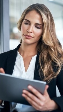 Women Holding Tablet (cropped image)